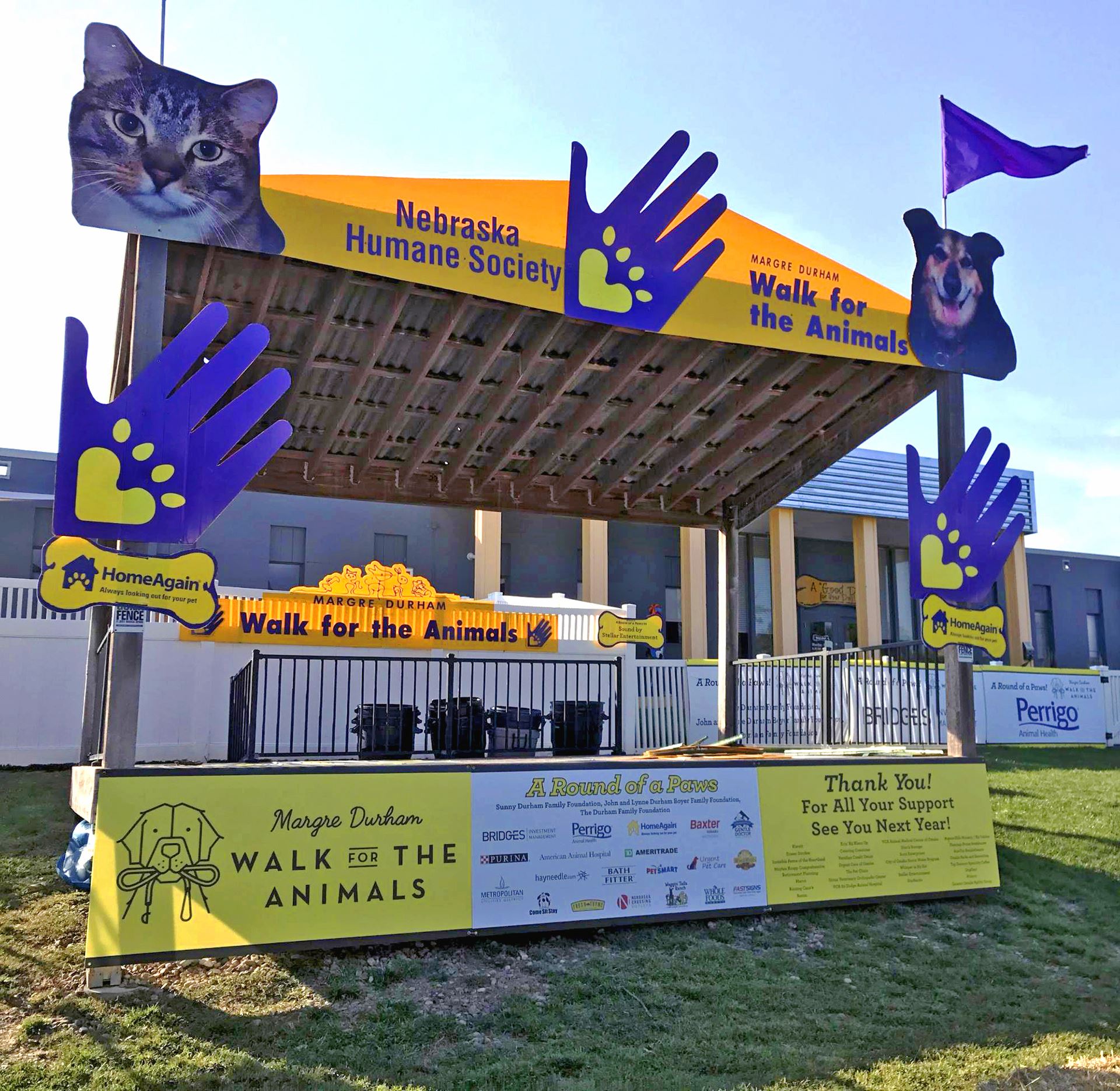 Custom exhibition display with stand-up banners and table graphics