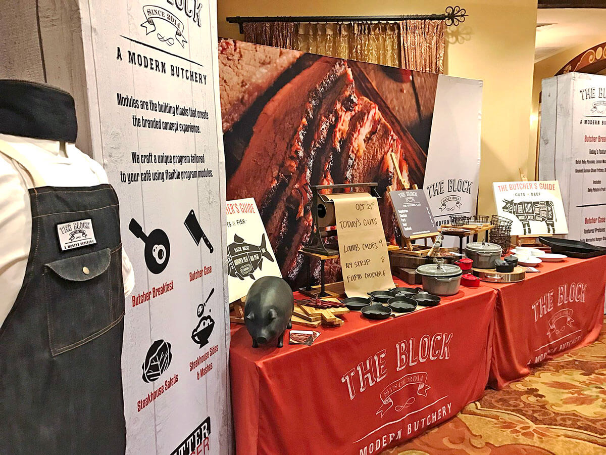 Custom exhibition display with stand-up banners and table graphics